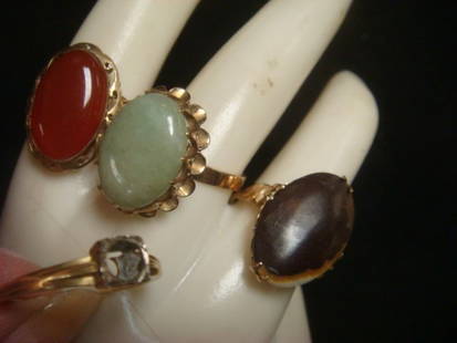 Four 14KT Gold Ladies Rings:: Four 14KT Gold Ladies Rings: Brown Agate, Prong Mounted. Carnelian Agate, Bezel Set. Green Jade in Trapeze Setting. All Size 8. Wedding Band, No Stone, Size 7 1/2. (100-200)