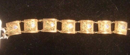 TOPAZIO Portugal Enamel Sterling Filigree Bracelet:: TOPAZIO Portugal Enamel Sterling Filigree Bracelet: Circa 1950. 6 1/2"L, Stamped on Reverse. 7 Links with Blue and Green Enameled Flowers. 11.5 Grams. Linked with Single Loop and Spring Clasp. 