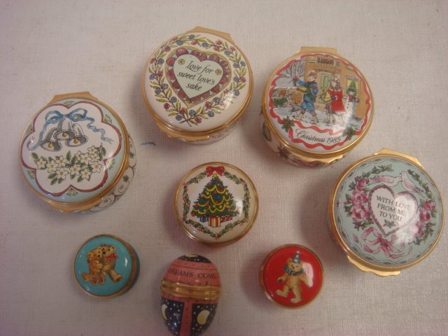 Nine HALCYON DAYS Enamel Trinket and Pill Boxes:: Nine HALCYON DAYS Enamel Trinket and Pill Boxes: Includes 1989 and 1990 Valentines, 1985 Christmas, Wedding, Christmas Tree and 2 Teddy Bear Pill Boxes and 1 1/2" Egg "May all Your Dreams Come True". 