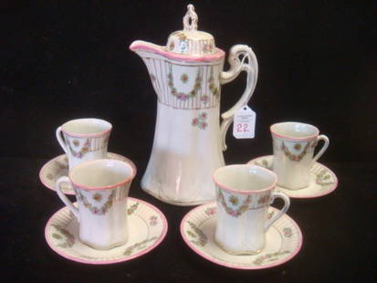 Porcelain Chocolate Set Marked Made in Nippon:: Porcelain Chocolate Set Marked Made in Nippon: Flared Base Chocolate Pot is 9 1/2"T. Pink Rims with Hand painted Floral Swags. 4 Matching Cups and Saucers. (40-60)