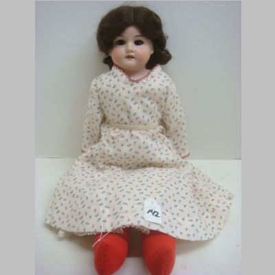 ARMAND MARSEILLE Porcelain Head Doll:: ARMAND MARSEILLE Porcelain Head Doll: Marked AM 3/70, Kid Body, Repainted Porcelain Hands, Brown Glass Sleep Eyes, Dolly Face. 6 Jointed, Age Stains To Leather. 22"T (200-300)