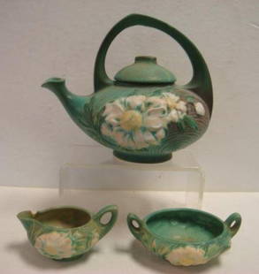 ROSEVILLE PEONY TEA SET IN Green:: ROSEVILLE PEONY TEA SET IN Green: Floral Arrangement with Green Leaves on Textured, Shaded Background of Green With Pale Pink Flowers & Yellow Centers. #3 & #3-S (Chip on Spout of Creamer) Cir.