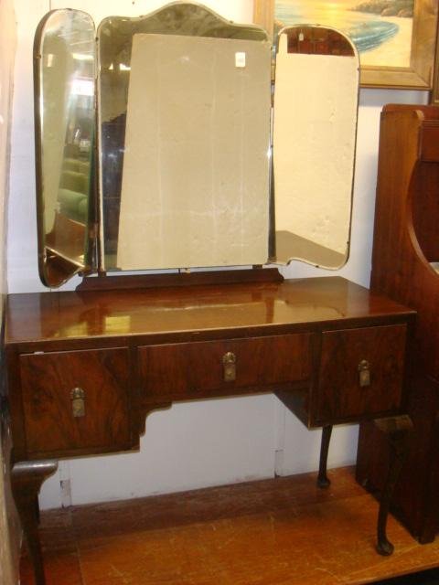 English Vanity with Tri-Fold Mirror:: English Vanity with Tri-Fold Mirror: First Half of 20th C Mahogany Dressing Table has 3 Drawers Over Center. Curved Legs with Pad Feet. Art Deco Metal Pulls. Drawer Fronts Appear to have Rosewood Vene