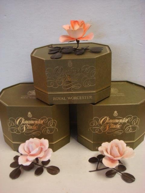 Three ROYAL WORCESTER Porcelain and Bronze Roses:: Three ROYAL WORCESTER Porcelain and Bronze Roses: Ornamental Studio Porcelain Roses with Bronze Stems and Leaves are Approximately 4"T. All with Original Boxes. (100-200)