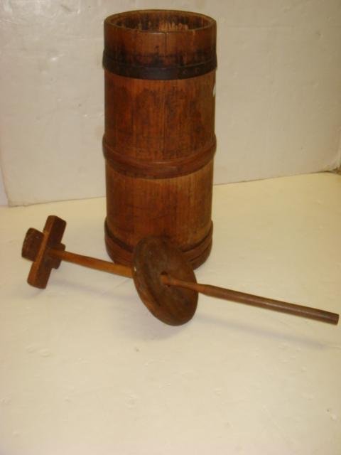19th C Pine Butter Churn with Dasher:: 19th C Pine Butter Churn with Dasher: Churn has Hand Forged Iron Band Atop 2 Wooden Bands Encircling. Stave and Hoop Construction. Wooden Lid with Hole. 21"T X 8"D at Top, 9 1/2"D at Bottom. (80-100)