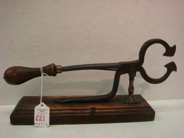 Antique Sugar Nippers On Wooden Base:: Antique Sugar Nippers On Wooden Base: Iron Nippers with Wooden Handle are Mounted on Beveled Wooden Base, Used for Breaking Off Chunks of Sugar from Sugar Cones. 13 1/2"L. (200-400)