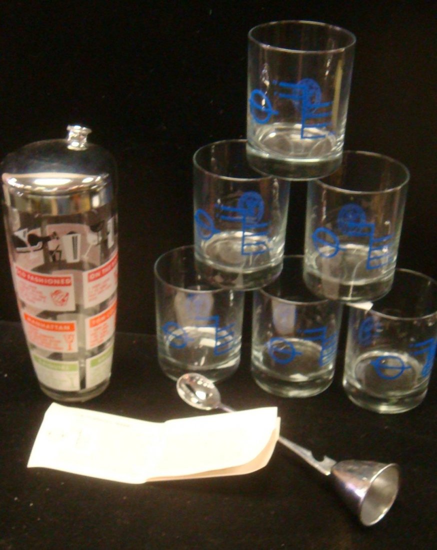 Six Shipyard Glasses, Cocktail Shaker and Mix Spoon:: Six Shipyard Glasses, Cocktail Shaker and Mix Spoon: Metal Jigger and Spoon, Cocktail Shaker with Recipes and Six Manhattan Glasses with Newport News Shipyard Logo on Sides. (30-100)