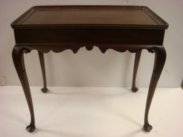 VIRGINIA GALLERIES BY HENKLE HARRIS Tea Table:: VIRGINIA GALLERIES BY HENKLE HARRIS Tea Table: Mahogany Table has Shaped Apron, Raised Edge Top, Slide Out Shelves at Sides and Queen Anne Style Legs Ending in Pad Feet. 26 1/2"T, 18" X 29 1/2". (200-