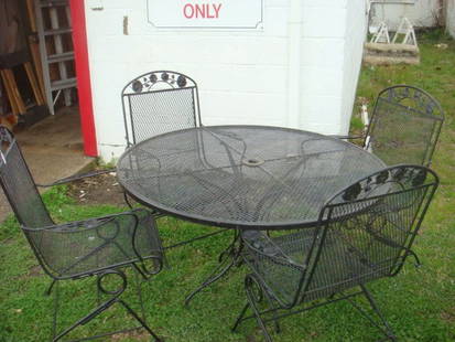 Wrought Iron Pation Table And Four Chairs:: Wrought Iron Pation Table And Four Chairs: Round Table is 4' in Dia. Open Weave Pattern With Spring Rockers on Chairs. Table is Adaptable for Umbrella. Painted Black. (200-300)