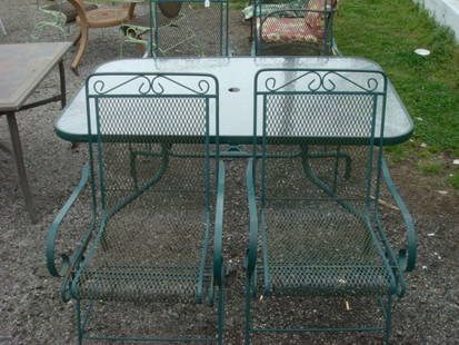 Metal Glass Top Table With 4 Chairs:: Metal Glass Top Table With 4 Chairs: Green Table With Pebbled Tempered Glass; 5' x 3'2". Spring Controlled Rocking Chairs. Table is Umbrella Adaptable. (300-400)