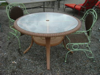 All WEATHER WICKER Table & 2 Wrought Iron Chairs:: All WEATHER WICKER Table & 2 Wrought Iron Chairs: Round, 2 Tiered Table is Umbrella Adaptable and 46' in Dia. 2 Chairs Have Woven Back and Seats. (150-200)