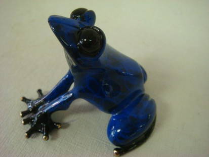 TIM COTTERILL BRONZE FROG "INDIGO" Figurine:: TIM COTTERILL BRONZE FROG "INDIGO" Figurine: Deep Blue Patinaed. Signed and Dated 2011; 33/5000. 2 1/2"T x 3"W x 2 5/8"L Does Not Have Certificate of Authenticity. Rough Spot on Foot. (200-300)