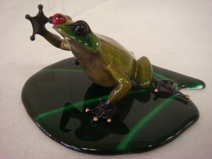 TIM COTTERILL BRONZE FROG "BUGSY" Figurine:: TIM COTTERILL BRONZE FROG "BUGSY" Figurine: Deep Green Frog With Red Ladybug on His Nose. Released In 2008, 34/5000. Certificate of Authenticity Included. Small Glaze Chip On Back. 2 3/8"T x 4 1/4"L