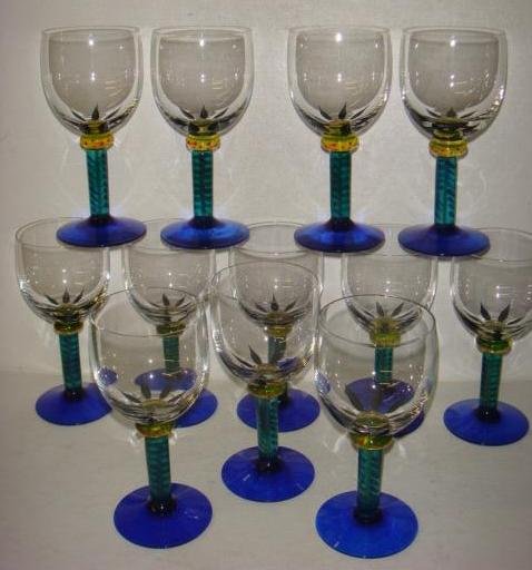 Twelve KOSTA BODA Ken Done Palm Trees Wine Goblets:: Twelve KOSTA BODA Ken Done Palm Trees Wine Goblets: Ca 199-2003. Handpainted Stems by Ken Done Australian Artist. Etched on Bottoms Kosta Boda Ken Done 24206. 6 1/2"T. Cobalt Foot, Green Stem. Signed
