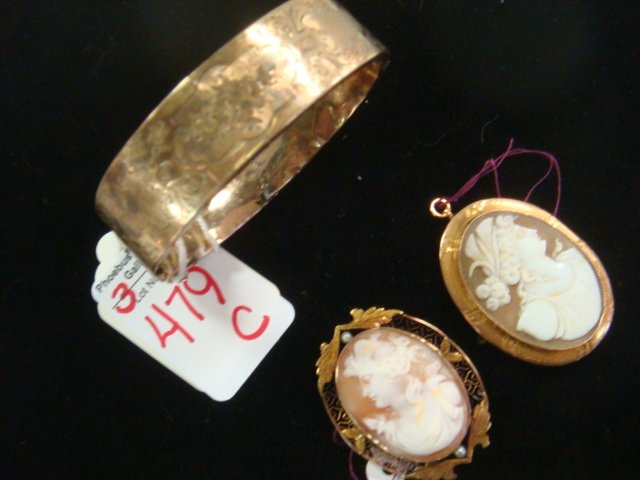 Two Oval Carved Shell Cameos and Bracelet:: Two Oval Carved Shell Cameos and Bracelet: Classical Female Profiles Bezel Set. Right Face in 10KT Incised Gold Frame, Left Face in Filigree Frame with 2 Pearls. Pendant and Pin Bar. 1 1/2"L.1/2"W Bra