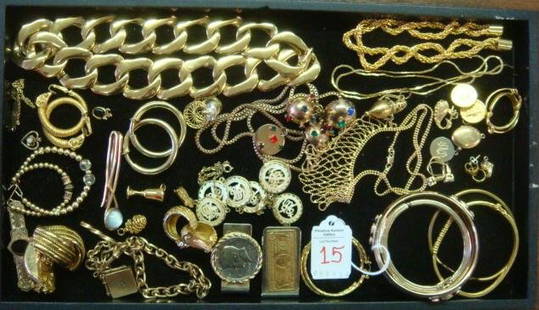 Selection of Goldtone Ladies Costume Jewelry:: Selection of Goldtone Ladies Costume Jewelry: Heavy Link Necklace, Bangle Bracelets, Clip and Pierced Earrings. Unusual Sweater Clip, Many Charms. 2 Money Clips-One 1964 Kennedy Half. Bib Bead