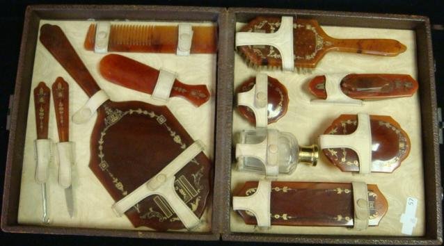 Outstanding Vintage Celluloid Vanity Dresser Set:: Outstanding Vintage Celluloid Vanity Dresser Set: Eleven Accessories in Original Fitted Leather Case. Includes Buffer, Brush, Clothes Brush, Beveled Hand Mirror, Box, Powder Box, Shoe Horn, Button Hoo