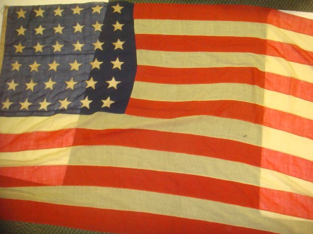 Hand Sewn 36 Star ANNIN & CO American Flag:: Hand Sewn 36 Star ANNIN & CO American Flag: Marked Annin & Co Makers, NY with Signed Tag of J.M Kitchen. All Handstiched Worsted Wool. 70" X 120". (1000-4000)