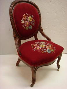 Victorian Mahogany Framed Balloon Back Chair:: Victorian Mahogany Framed Balloon Back Chair: Red Needlepoint Seat & Back, Carved Back Frame Rail, Hip Rests, Curved Skirt, Cabriole Legs W/Pad Feet On Brass Casters. (100-200)