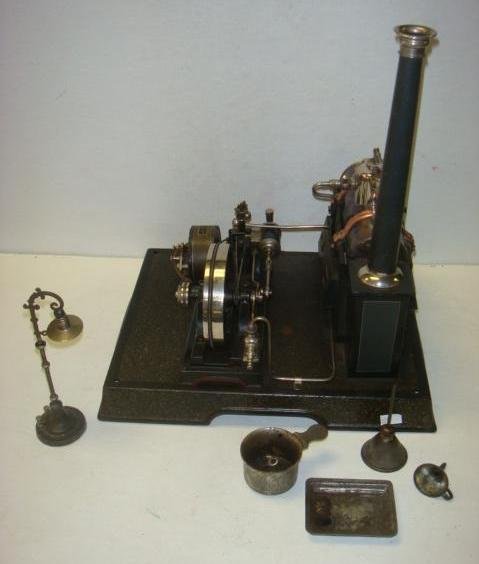 Vintage MARKLIN Steam Engine, Horizontal, No 4149:: Vintage MARKLIN Steam Engine, Horizontal, No 4149: CA 1920 MARKLIN NO 4149 Horizontal Steam Engine with Chimney, Flywheel and Dynamo on Platform Base. 14 1/4" x 13" x 10". Original Wooden Box with Sli