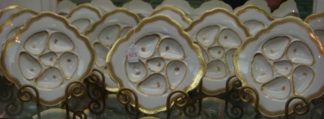 Set of 12 German Porcelain Oyster Plates:: Set of 12 German Porcelain Oyster Plates: Each has 5 Gilt Outlined Wells Plus Center Sauce Well. Beautiful Ornate Gilt Vine Band Surrounding Scalloped Edge. Marked J.M.c. D.& S. Germany and Crown Mark