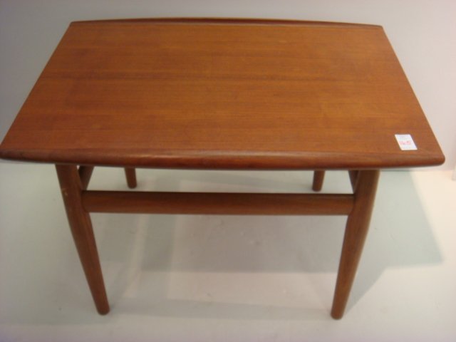 Danish Modern Teak Side Table:: Danish Modern Teak Side Table: Made in Denmark by Glostrup Mobelfabrik. Metal Accents on Box Stretcher. Tapering Legs. Rolled Edge Sides on Top. 19"T, 20" X 27 1/2". (160-240)