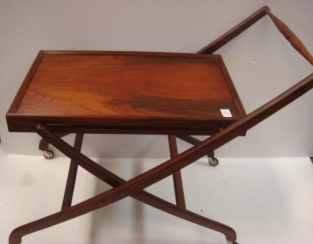 Replica of SHEPHEARD HOTEL Bar Cart:: Replica of SHEPHEARD HOTEL Bar Cart: Ca 20thC. Made by M. Hayat Brothers, LTD (Furniture Explorers), Pakistan for BOMBAY CO. Streamline Form W/Collapsible frame. Rolling Cart has 27"x17" Top & is 29"T