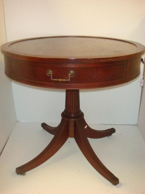 HEKMAN Mahogany Drum Table:: HEKMAN Mahogany Drum Table: Single Drawer with 3 Faux Drawers. 28"T with 30" Diameter Top. Fluted Pedestal with 4 Splayed Duncan Phyfe Legs Ending in Metal Capped Feet on Castors. Leather Top Has Been