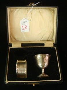English Sterling Christening Egg Cup & Napkin Ring:: English Sterling Christening Egg Cup & Napkin Ring: In Original Satin and Velvet Lined Case. Egg Cup has Gold Wash Interior. 1 3/4"T. Fish Scale Pattern Napkin Ring is 1 3/4"D. Both with Birmingham