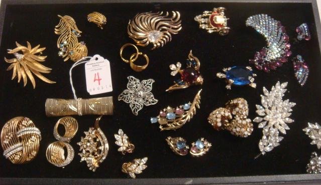 An Array of Ladies Costume Jewelry:: An Array of Ladies Costume Jewelry: Jomaz Pin/Earring Set, Boucher Floral Pin, Sterling Revlon Lipstick Case, 3 Trifari Rhinestone and Colored Stone Suit, Trifari Fish Jelly Belly, Kramer Turtle, Unus