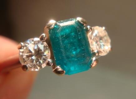10KT Emerald and Diamond Ladies Ring:: 10KT Emerald and Diamond Ladies Ring: Prong Set Stones with Horseshoe Shape Guard, Size 6 1/2. Brilliant Cut Diamonds Weigh .67CT, Color G-H, SI1 and VVS2 Clarity. Abraded Crown. Emerald Cut Emerald w