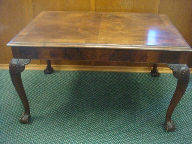 19th Century Walnut Writing Table:: 19th Century Walnut Writing Table: Matched Veneer Top with Inlaid Border and Beveled Edge. 4" Figural Apron. Raised on Cabriole Legs with Leaf and Shell Carved Knees. Slender Ankle Ending in Large Bal