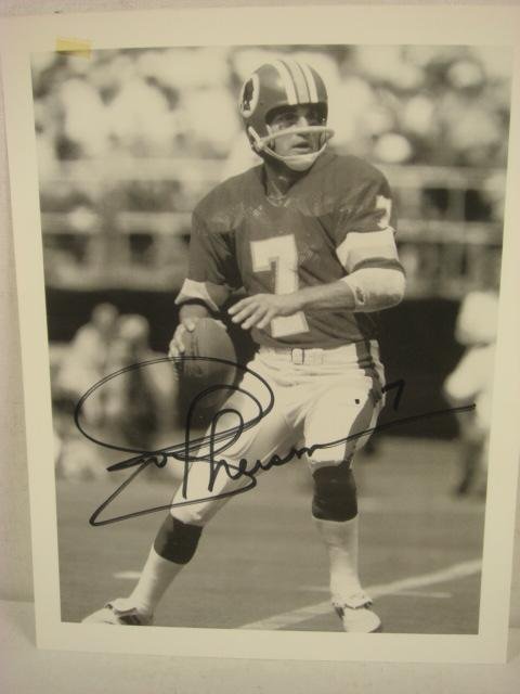 Autographed JOE THEISMANN Photograph:: Autographed JOE THEISMANN Photograph: #7 For The Washington Redskins. Black & White 8 1/2 X 11 Signed Photo in Black Marker. (25-50)