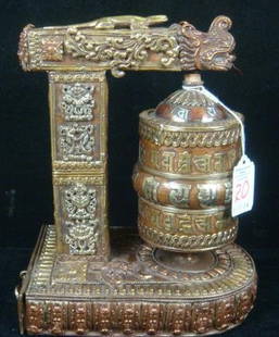 Buddhist Table Top Prayer Wheel In Dragon Stand:: Buddhist Table Top Prayer Wheel In Dragon Stand: Copper and Brass Cylindrical Wheel on Spindle with 3 Lines of Mantra in Sanskrit. Drawer at Bottom to Place Mantra. Clockwise Spin of Mani Wheel and