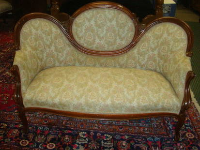 Victorian Mahogany Framed Medallion Back Settee:: Victorian Mahogany Framed Medallion Back Settee: 19th C. Seating with Molded Frame. Denter Medallion Joined to Side Lobes with Carved Flower and Scroll. Peach and Seafoam Floral Upholstery. 50" Arm