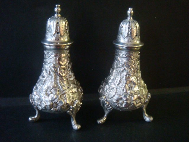 S KIRK & SON Sterling Repousse Salt/Pepper Shakers:: S KIRK & SON Sterling Repousse Salt/Pepper Shakers: Each with 3 Curved Legs. 4"T. NCR Monogram on Bottoms. (180-280)