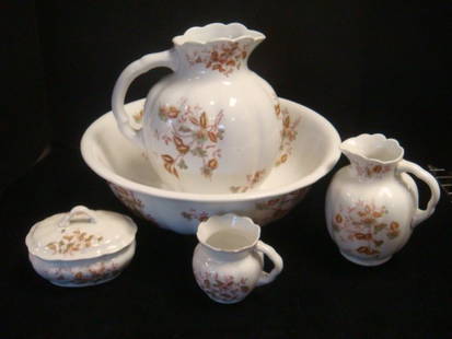 19th C. Victorian Six Pc. Wash Set:: 19th C. Victorian Six Pc. Wash Set: White with Floral Pattern. Covered Soap Dish with Insert, Individual Pitcher, Shaving Mug, Water Pitcher and Bowl. Hairline On Bottom of Bowl and Neck of Pitcher.