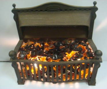 ELECTRIC GLO-HOT GRATE, Floor Heater:: ELECTRIC GLO-HOT GRATE, Floor Heater: By Colonial Fireplace Company of Chicago Ill. Electic Heater with Obsidian Rocks to Give Warm Glow on Cold Winter Nights. Amber Fire Glass. 25" x 24" x 12", 75