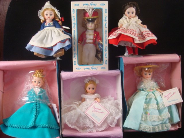 Five MADAME ALEXANDER Dolls And Ideal Shirley Temple:: Five MADAME ALEXANDER Dolls And Ideal Shirley Temple: All Hard Plastic, 8" Tall, Most Have Original Boxes. Bride-336; Portrettes (Violetta) 1116 and (Iris) 1112. Russia And Holland Do Not Have Boxes.