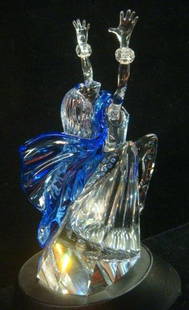 SWAROVSKI Crystal Isadora, Magic of Dance Series:: SWAROVSKI Crystal Isadora, Magic of Dance Series: Dancer with Arms Raised, Blue Cape. Issued 2002. 7 3/4"T. Has Stand and Plaque. Original Boxes. Isadora Duncan was Famous Dancer who Brought Movement