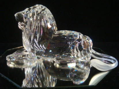 SWAROVSKI Crystal Inspiration Africa Lion:: SWAROVSKI Crystal Inspiration Africa Lion: Reclining Lion is 2 1/2:T, 5"L. Amber Eyes. Original Box. Ca 1995 Annual Edition. The King of Our Glass Menagerie. (200-300)