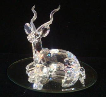 SWARVOSKI Crystal Inspiration Africa Kudu": SWARVOSKI Crystal Inspiration Africa Kudu" 1994 Annual Edition. Reclining Kudu has Frosted, Curled Horns. 4"T. Original Box. These Anemias are Among the Most Graceful of the Savannah. (200-300)