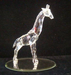 SWAROVSKI Crystal Baby Giraffe:: SWAROVSKI Crystal Baby Giraffe: Part of African Wildlife Series. Retired 2005. Original Box. Frosted Mane and Horns. 5 1/8"T. To Survive in the Wild, Baby Giraffes can Walk Within 3 Minutes of Being