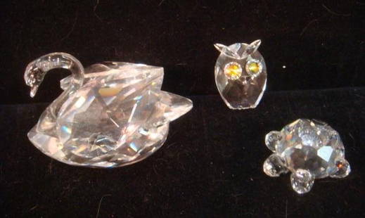 Three SWAROVSKI Crystal Beasts; Owl, Turtle & Swan:: Three SWAROVSKI Crystal Beasts; Owl, Turtle & Swan: Swan is 2"T, Turtle is 3/4"T and 1 1/4"T Owl Appears to have Been Attached to Something. Beak Chip. On Mirrors. No Boxes. Wisdom, Grace and