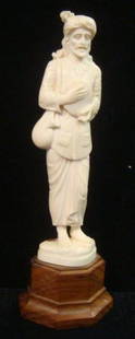 Carved Pre-ban Ivory Figurine of Traveling Musician:: Carved Pre-ban Ivory Figurine of Traveling Musician: Original Sticker "Government of Kerala, Dept. of I&C" Finely Detailed Figurine of Tambourine Player with Traveling Bag over Shoulder, Mounted on