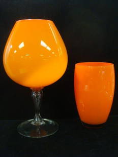 Orange Glass Brandy Snifter and Ovoid Vase:: Orange Glass Brandy Snifter and Ovoid Vase: Shiny Finish Snifter on clear Pedestal and Round Foot.15"T. Ovoid Vase with Clear Glass Bottom. 9 1/2"T. (100-200)