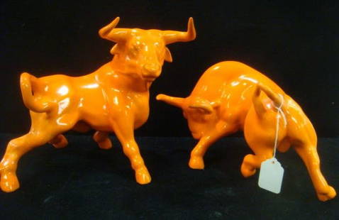 Pair of Molded Plaster Orange Bulls:: Pair of Molded Plaster Orange Bulls: Horns up, Horns Down, Shiny Painted Finish. First Measures 9"T; Second 7"T. (100-200)