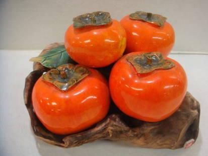 Persimmons Decorative Table Sculpture:: Persimmons Decorative Table Sculpture: Ceramic and Wood with Asian Chop Mark. 6"T X 7" X 8". Four Asian Fruits on Log Motif Base. Green Leaf Accent. (80-120)