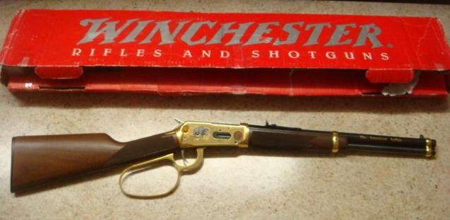 WINCHESTER Model 94 "American Indian Tribute" Rifle:: WINCHESTER Model 94 "American Indian Tribute" Rifle: Model 94 "Wrangler" 16" Carbine with Large Loop Lever from a Special Edition of 300. Decorated with Hunting and Buffalo Engraving on the Gold Recei
