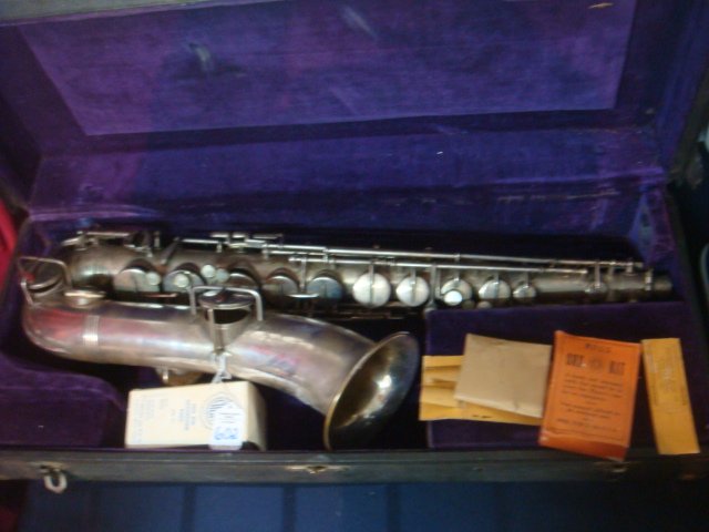 Wurlitzer American Saxophone with Hard Case:: Wurlitzer American Saxophone with Hard Case: Low Pitch Stencil Sax #148851, Brass w/Silver Overlay. Mother Of Pearl Buttons also has Sax Kit, Tan Kid Pads and Extra Reeds. Stencils were Made by Major